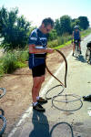 Brian fixing his flat after a big crash!  Good thing for helmets!